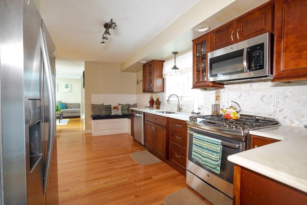 50 Forest Street Bridgewater, MA 02324 - Photo 17 of 42 a kitchen with stainless steel appliances a stove microwave and sink