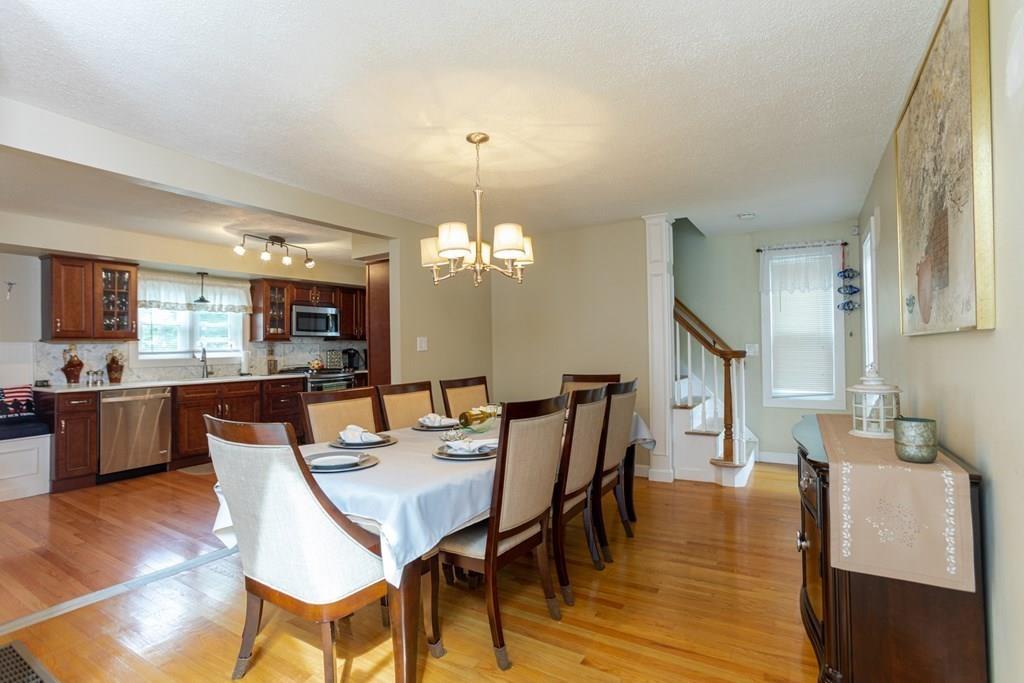 50 Forest Street Bridgewater, MA 02324 - Photo 21 of 42 a view of a dining room with furniture and wooden floor