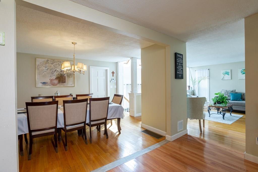 50 Forest Street Bridgewater, MA 02324 - Photo 22 of 42 a view of a dining room with furniture and wooden floor