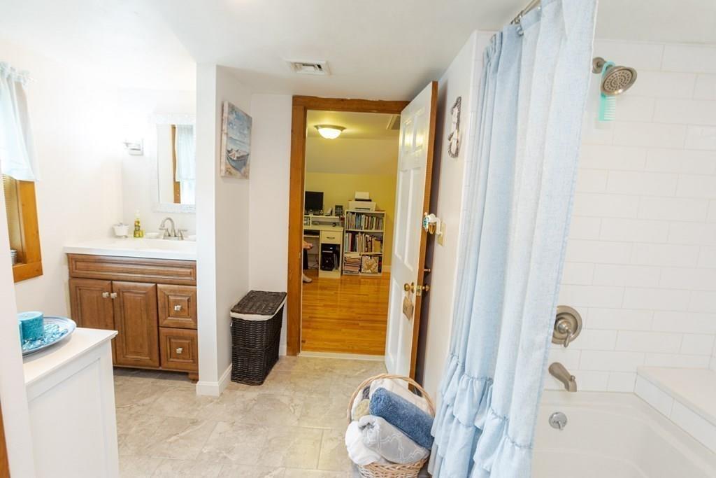 50 Forest Street Bridgewater, MA 02324 - Photo 26 of 42 a bathroom with a tub shower sink and toilet