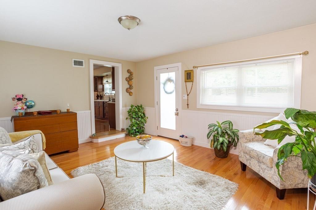50 Forest Street Bridgewater, MA 02324 - Photo 8 of 42 a living room with furniture and a potted plant