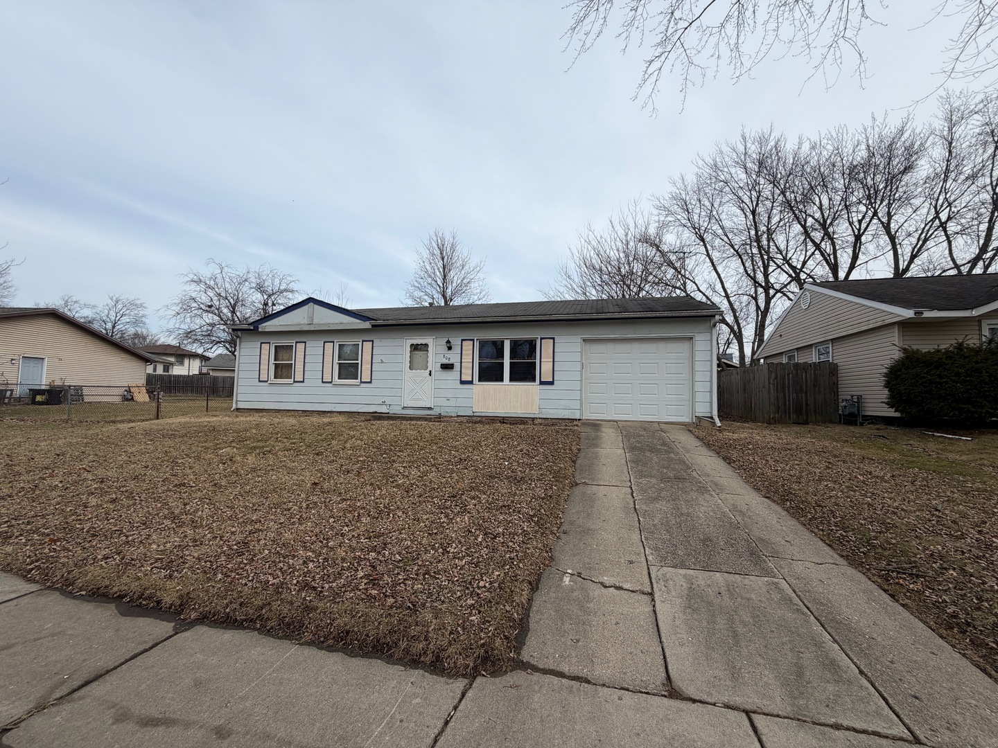 808 Sunset Circle Streamwood, IL 60107 - Photo 1 of 1 a front view of a house with garden