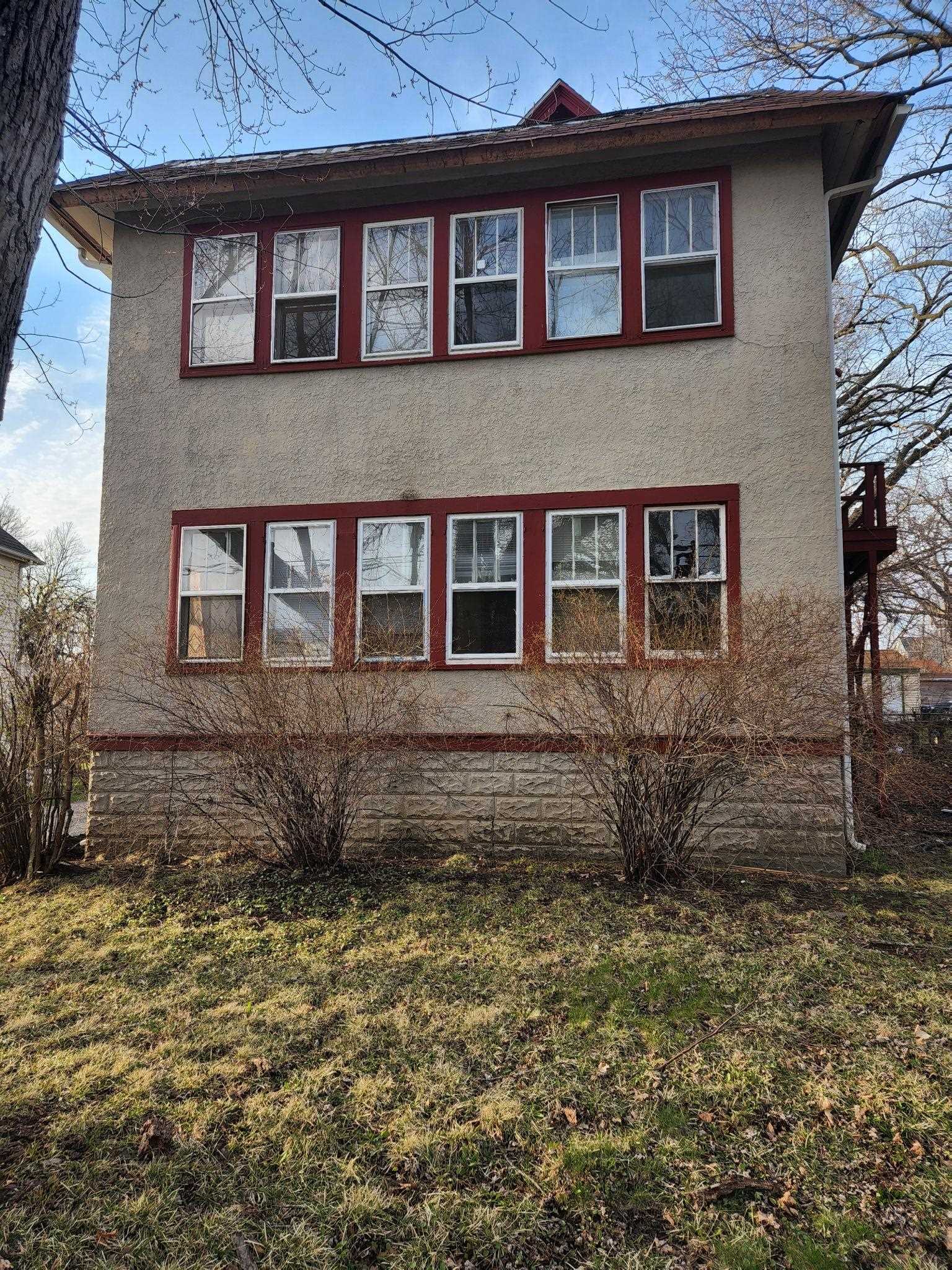 1410 Rural Street Rockford, IL 61107 - Photo 1 of 15 a front view of a house with a garden