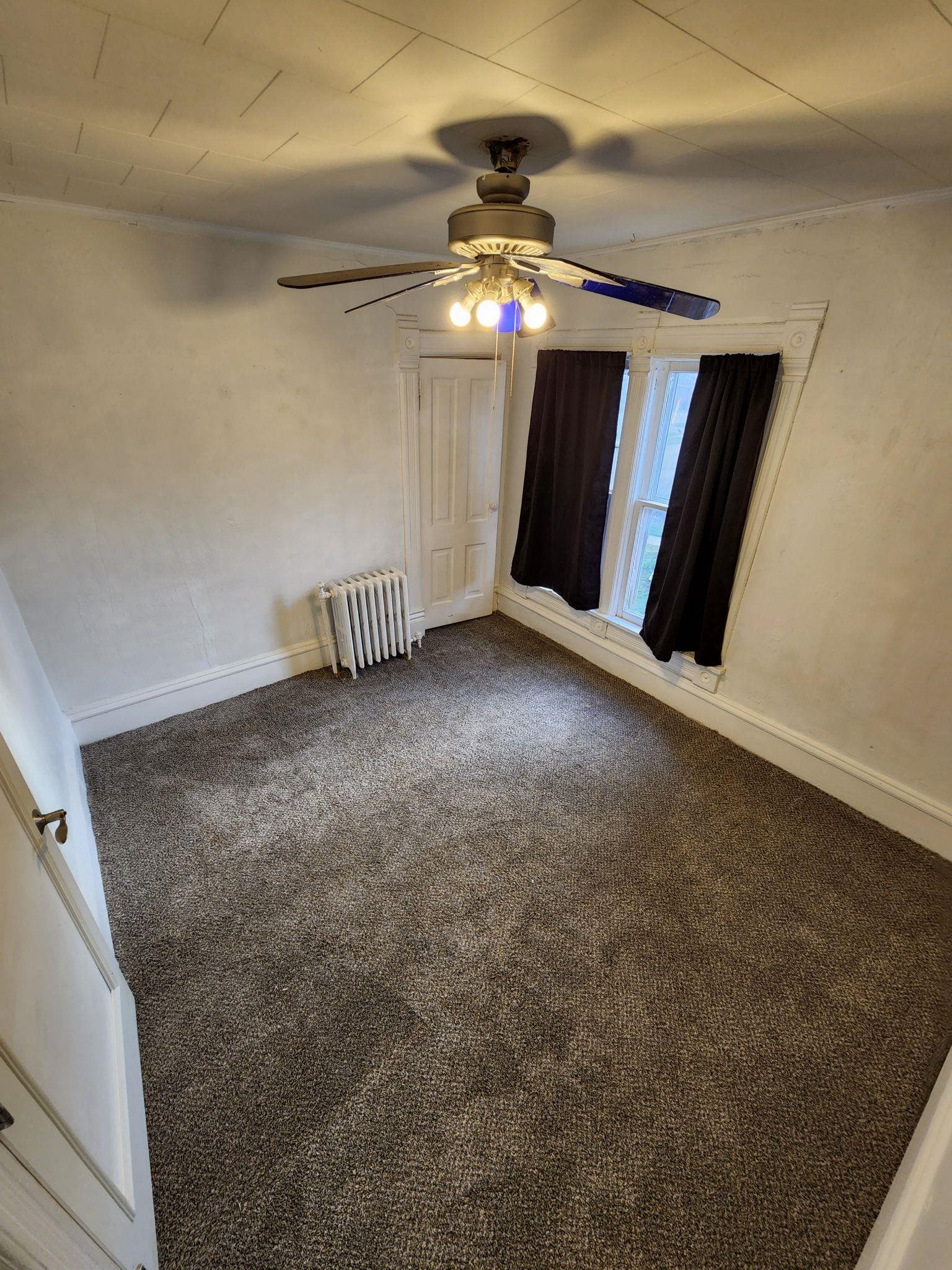 1410 Rural Street Rockford, IL 61107 - Photo 11 of 15 a view of an empty room with a fireplace