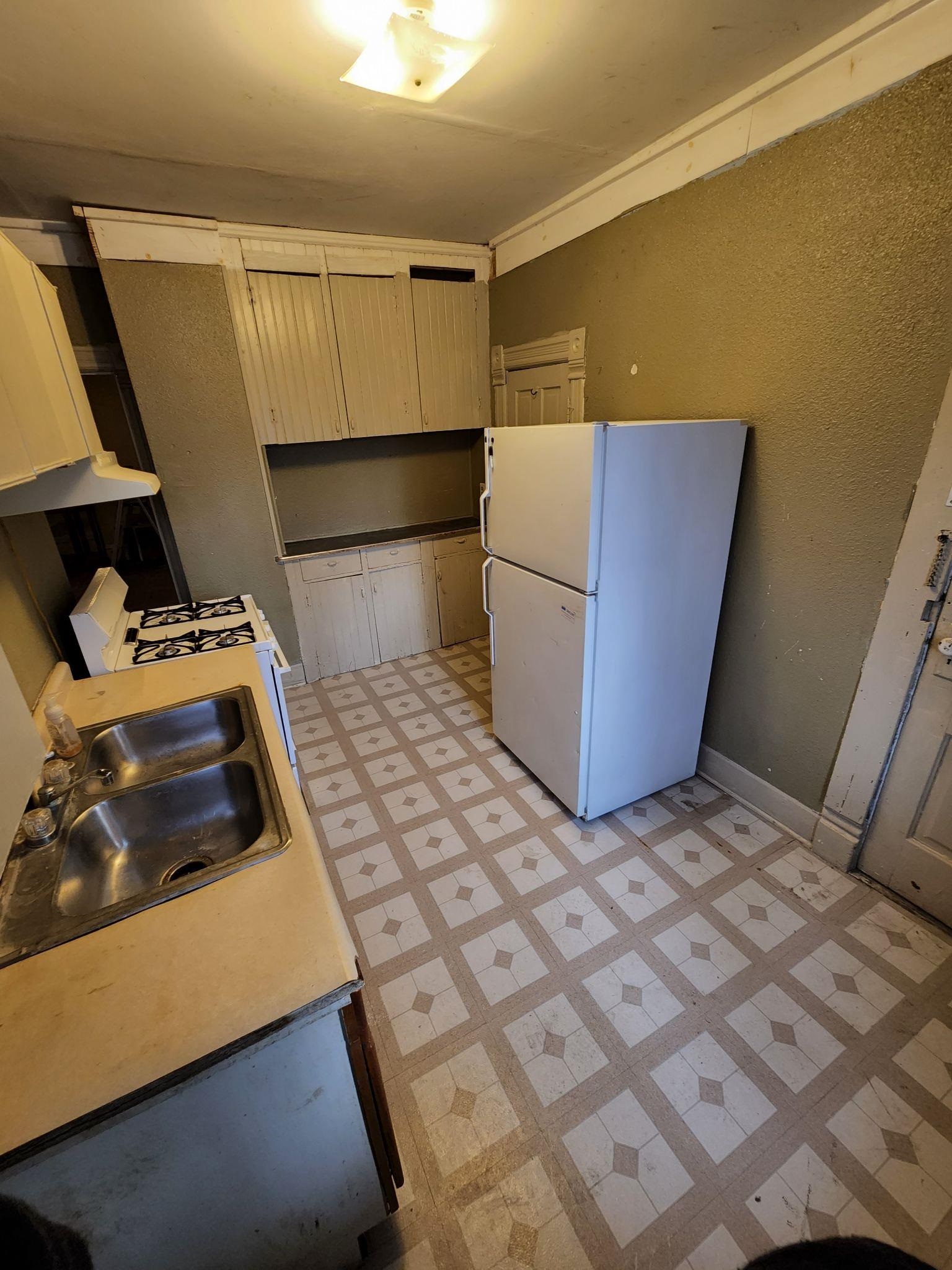 1410 Rural Street Rockford, IL 61107 - Photo 10 of 15 a bedroom with a bed and cabinets