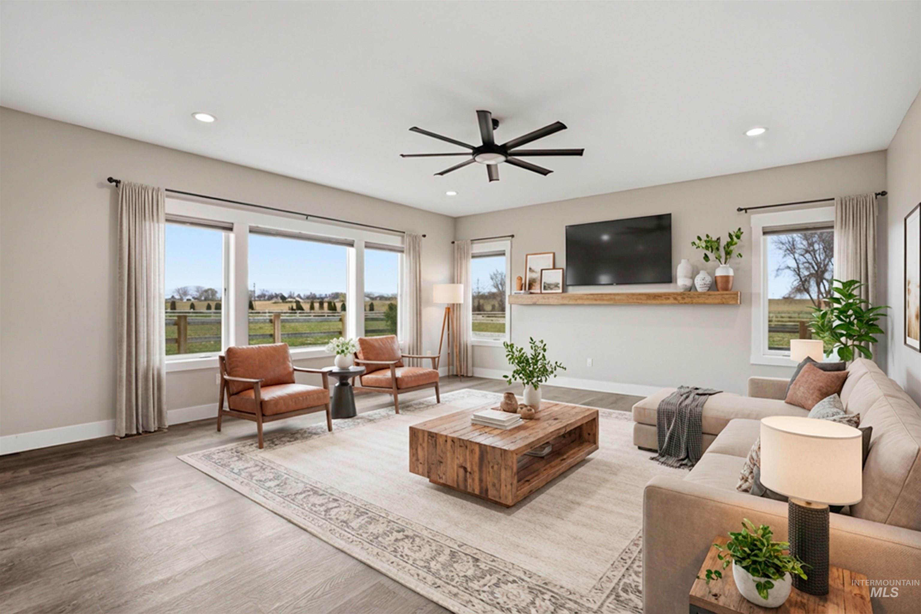 6617 Red Rock Road Marsing, ID 83639 - Photo 10 of 39 Living room featuring a ceiling fan, wood finished floors, and recessed lighting