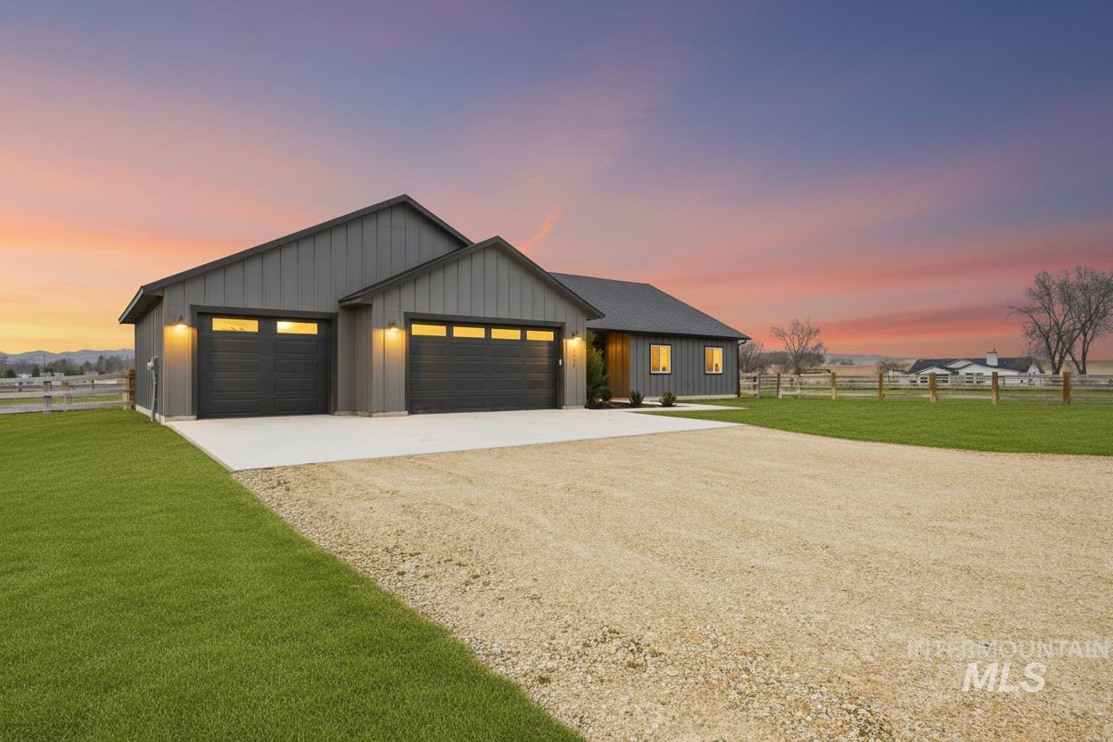 6617 Red Rock Road Marsing, ID 83639 - Photo 2 of 39 Modern farmhouse featuring driveway, board and batten siding, and a garage