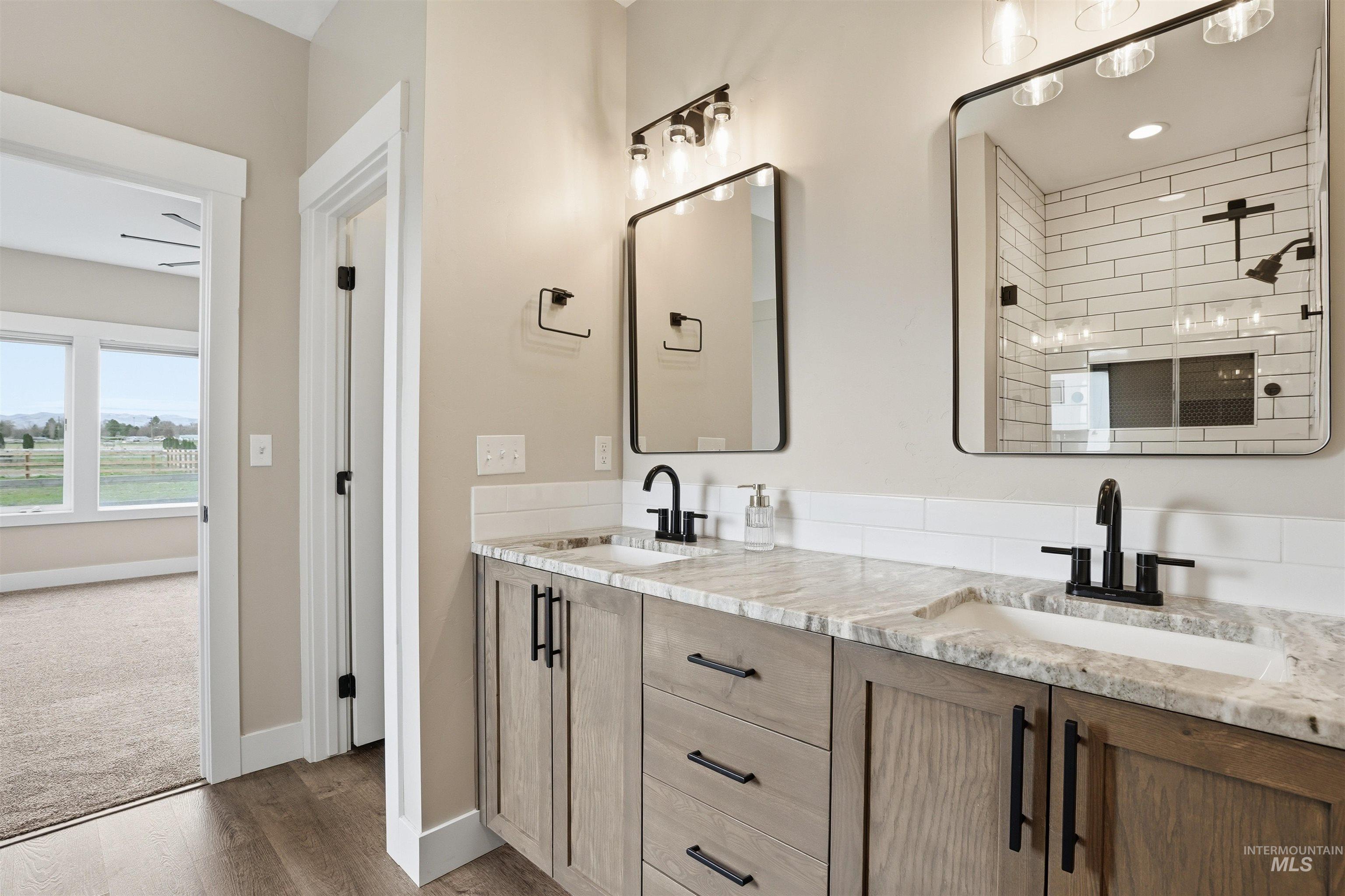6617 Red Rock Road Marsing, ID 83639 - Photo 19 of 39 Full bath with double vanity and wood finished floors