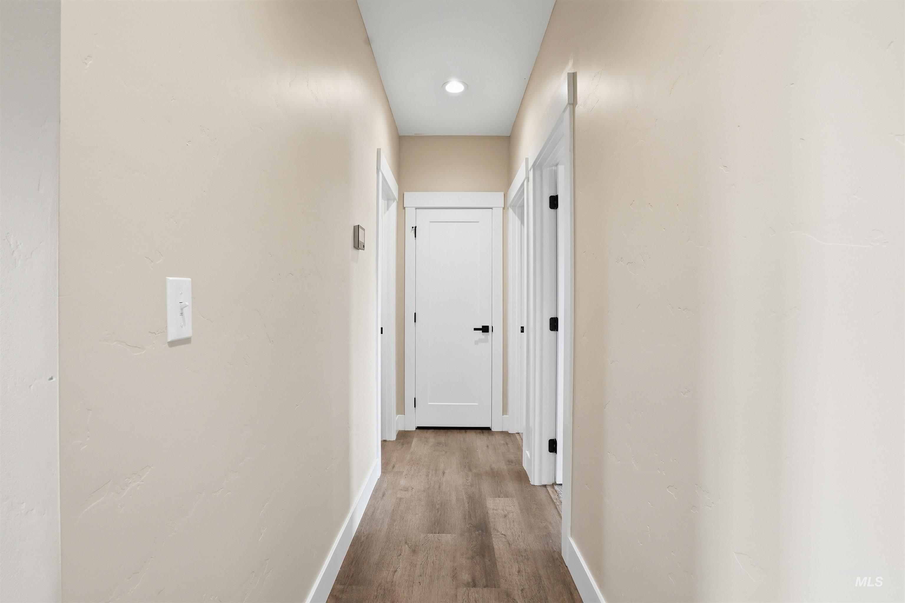 6617 Red Rock Road Marsing, ID 83639 - Photo 20 of 39 Corridor with light wood-style flooring and recessed lighting