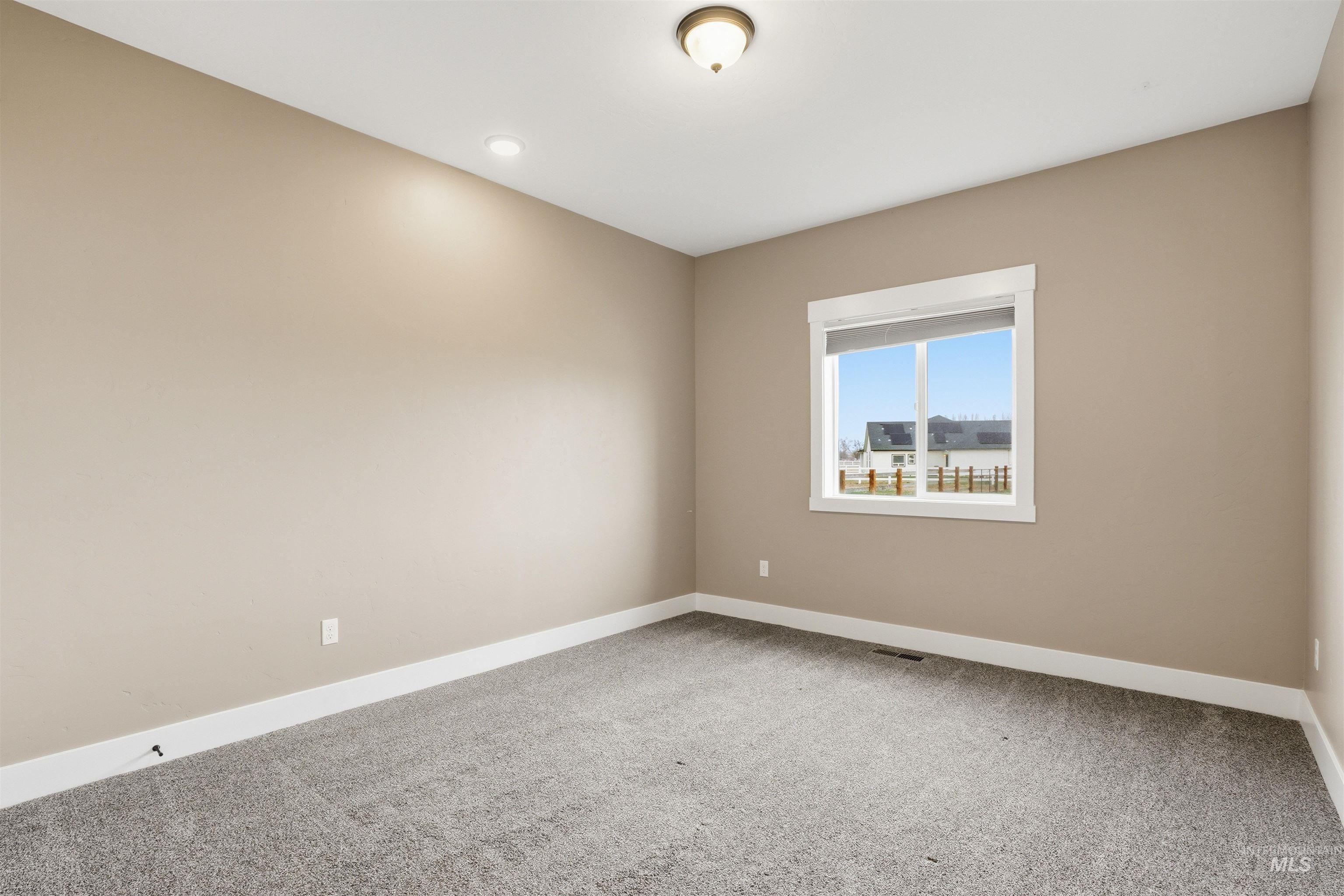 6617 Red Rock Road Marsing, ID 83639 - Photo 22 of 39 Spare room with baseboards and light carpet