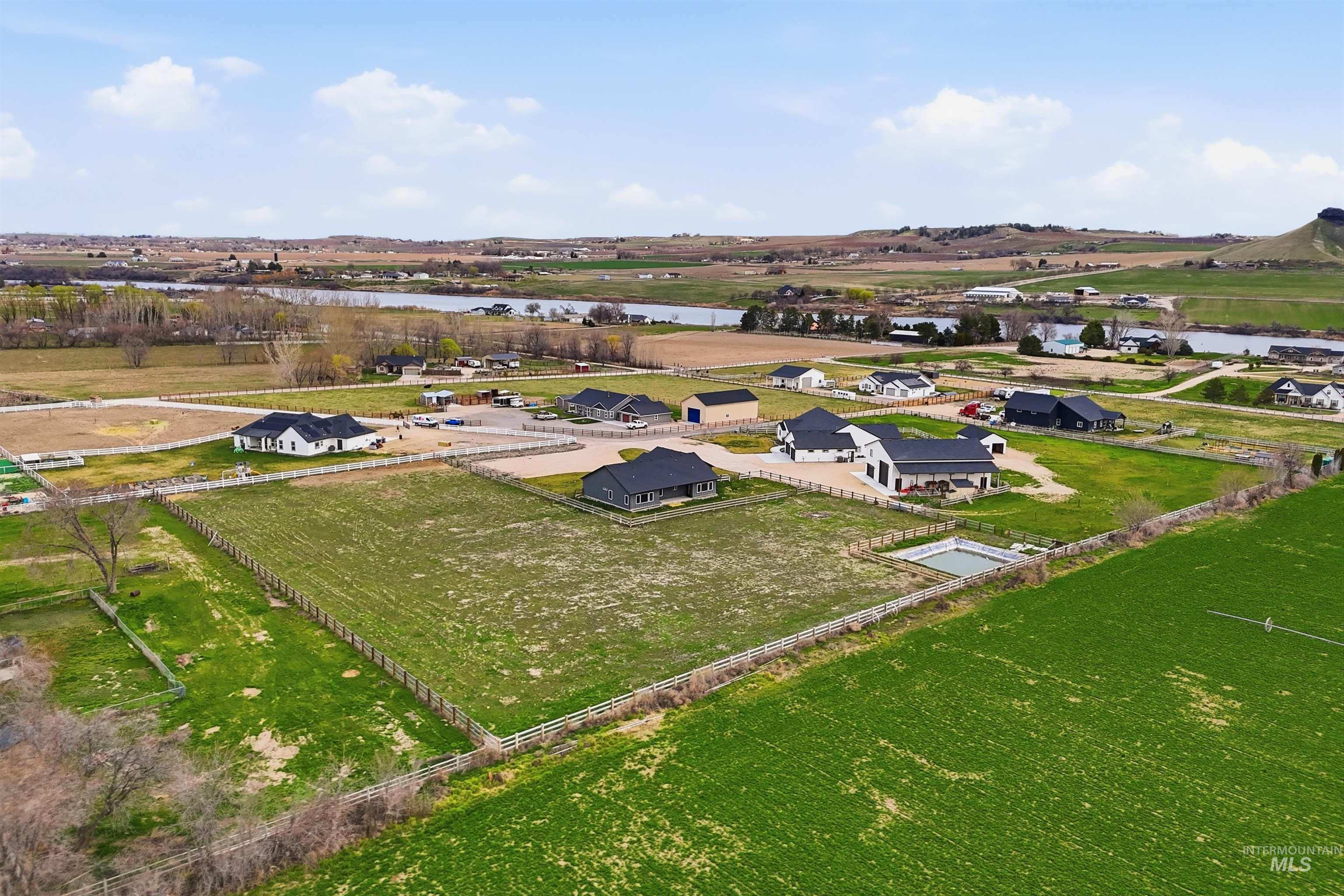 6617 Red Rock Road Marsing, ID 83639 - Photo 32 of 39 Aerial view of property and surrounding area featuring a large body of water and rural landscape