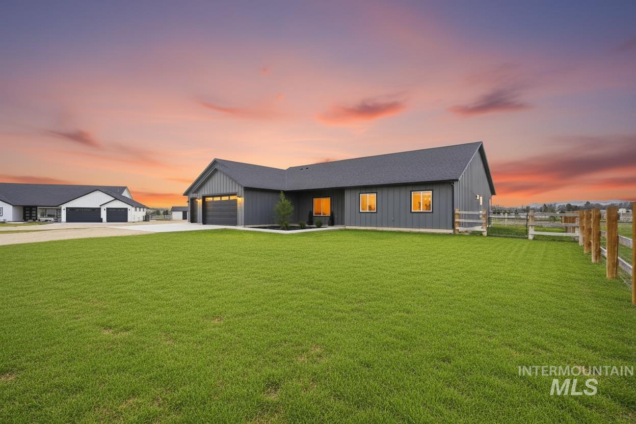 6617 Red Rock Road Marsing, ID 83639 - Photo 4 of 39 Modern farmhouse style home with board and batten siding, a garage, driveway, and a shingled roof