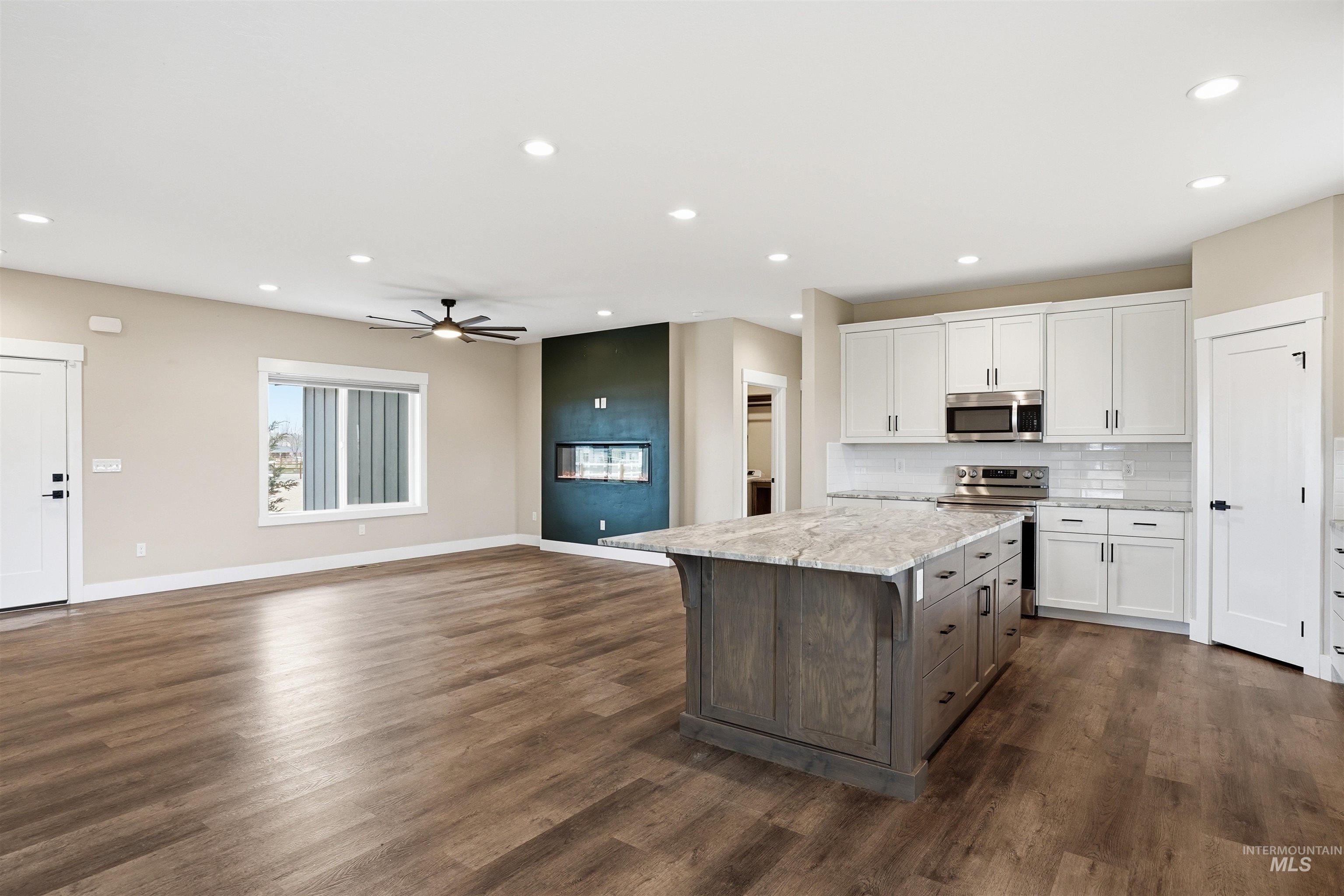 6617 Red Rock Road Marsing, ID 83639 - Photo 38 of 39 Kitchen featuring dual tone cabinetry, open floor plan, a kitchen island, stainless steel appliances, and recessed lighting