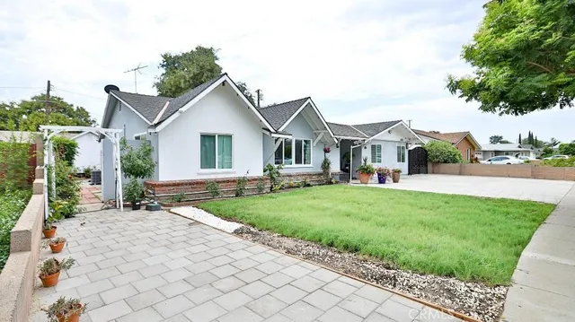 a view of a yard and front view of a house