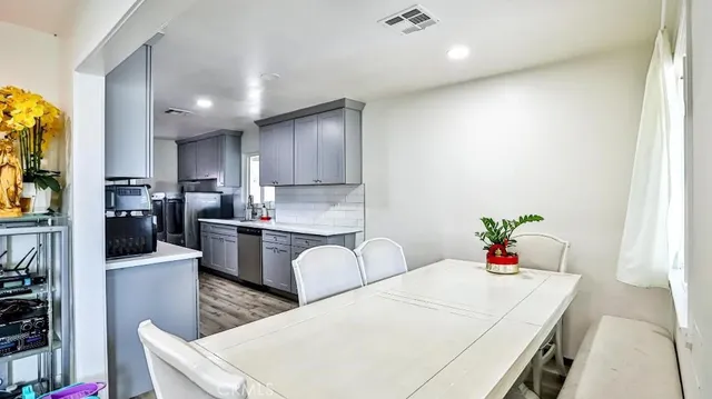a large white kitchen with lots of counter space
