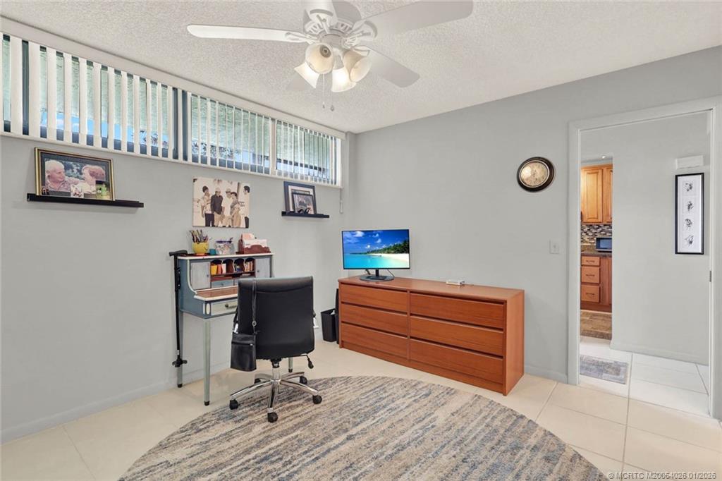 1950 Southwest Palm City Road, Unit 8106 Stuart, FL 34994 - Photo 32 of 54 a view of workspace with furniture and wooden floor