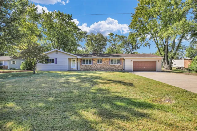 a house view with a garden space