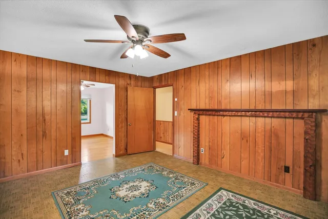 a view of an empty room and a window