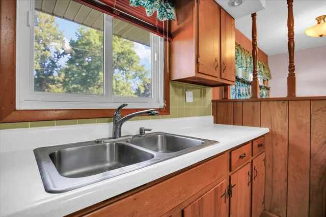 a kitchen with a sink and a window