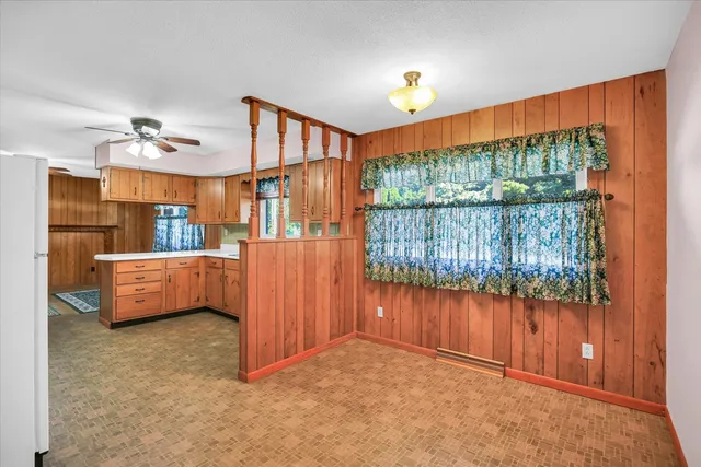 a view of a room with furniture and a window