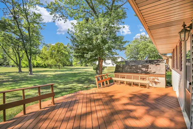 a view of a yard with wooden floor