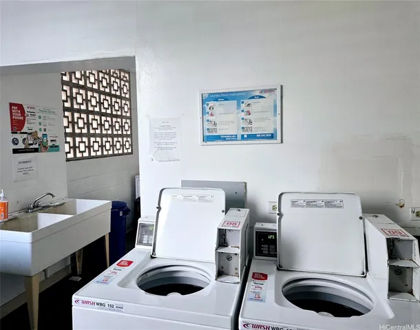 a utility room with a washing machine