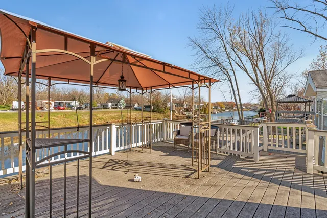 a view of a chairs and table in the patio