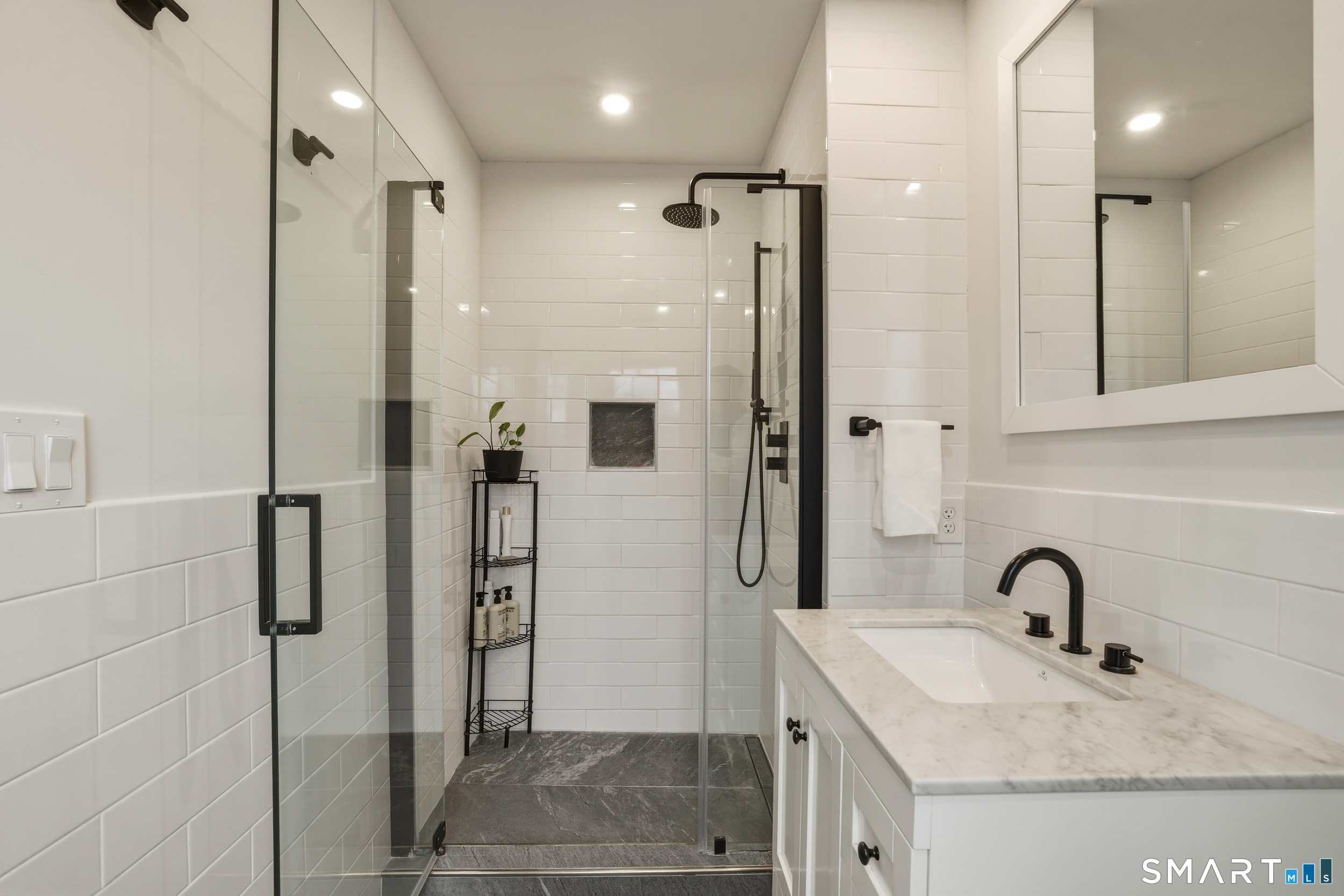 51 Sugar Loaf Road Guilford, CT 06437 - Photo 18 of 40 a bathroom with a sink shower and a mirror