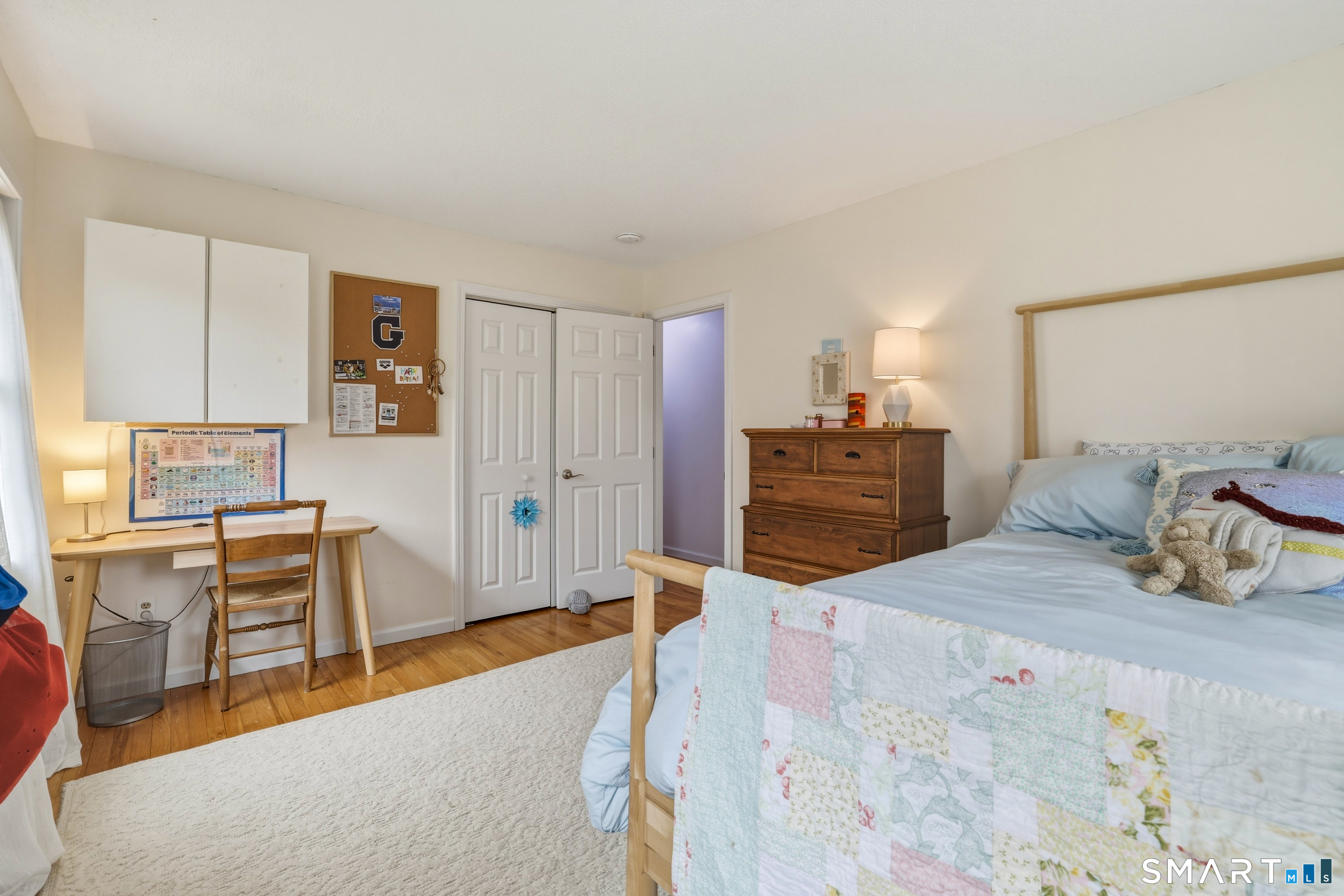 51 Sugar Loaf Road Guilford, CT 06437 - Photo 19 of 40 a bedroom with a bed and furniture