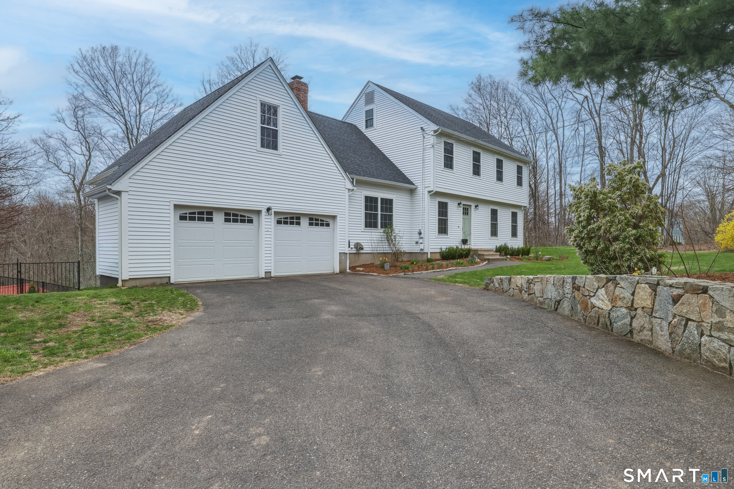 51 Sugar Loaf Road Guilford, CT 06437 - Photo 2 of 40 a view of a white house with a street
