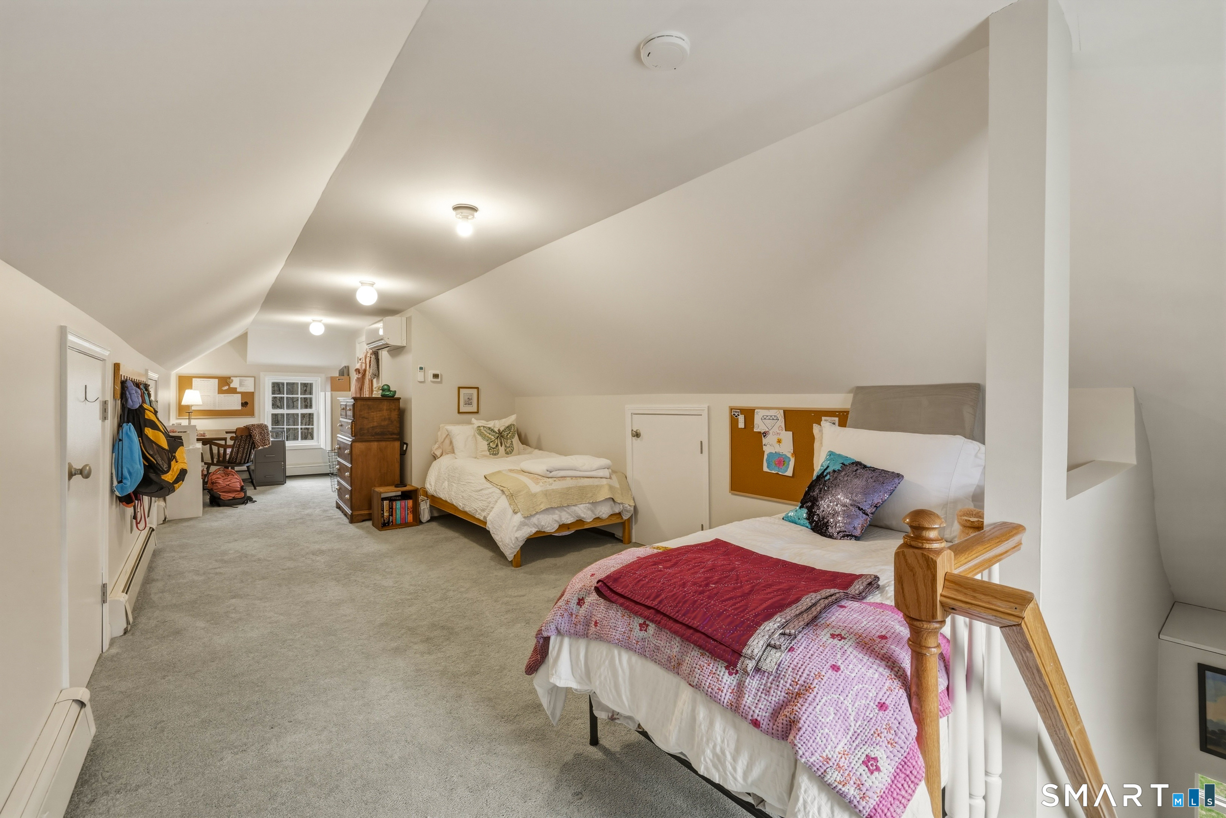 51 Sugar Loaf Road Guilford, CT 06437 - Photo 23 of 40 a bedroom with furniture and a bed