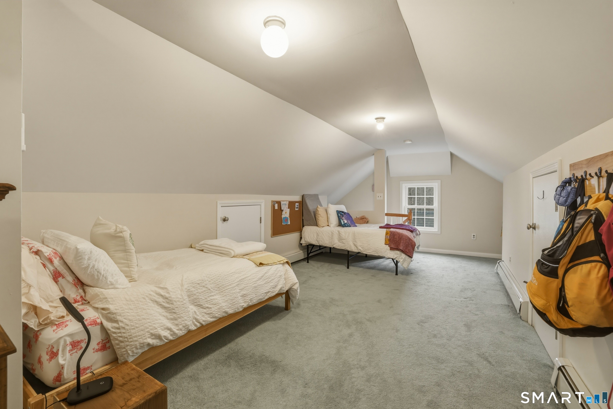 51 Sugar Loaf Road Guilford, CT 06437 - Photo 24 of 40 a bedroom with bed and a view of bedroom