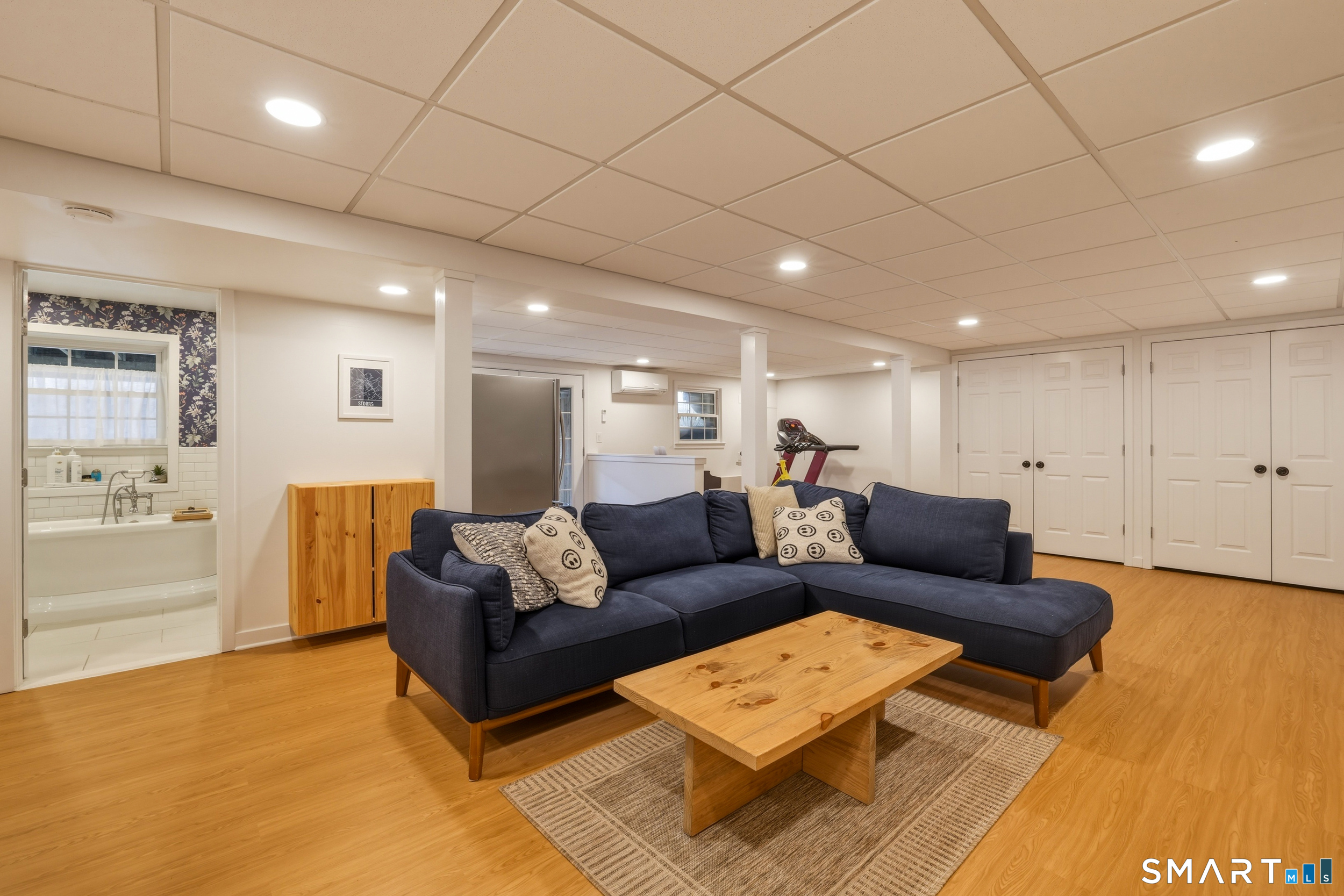 51 Sugar Loaf Road Guilford, CT 06437 - Photo 26 of 40 a living room with furniture and a wooden floor