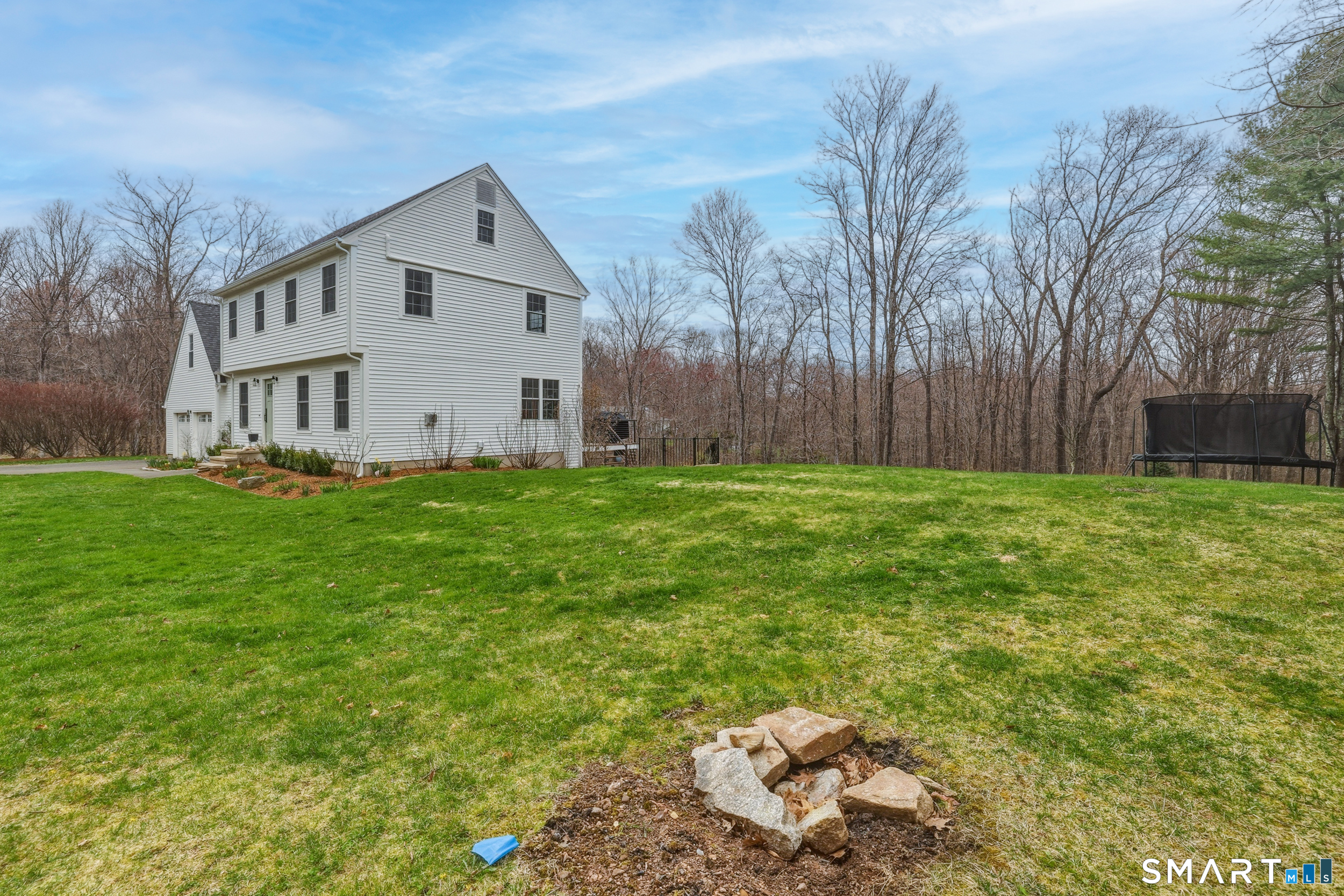 51 Sugar Loaf Road Guilford, CT 06437 - Photo 34 of 40 a view of a house with a yard