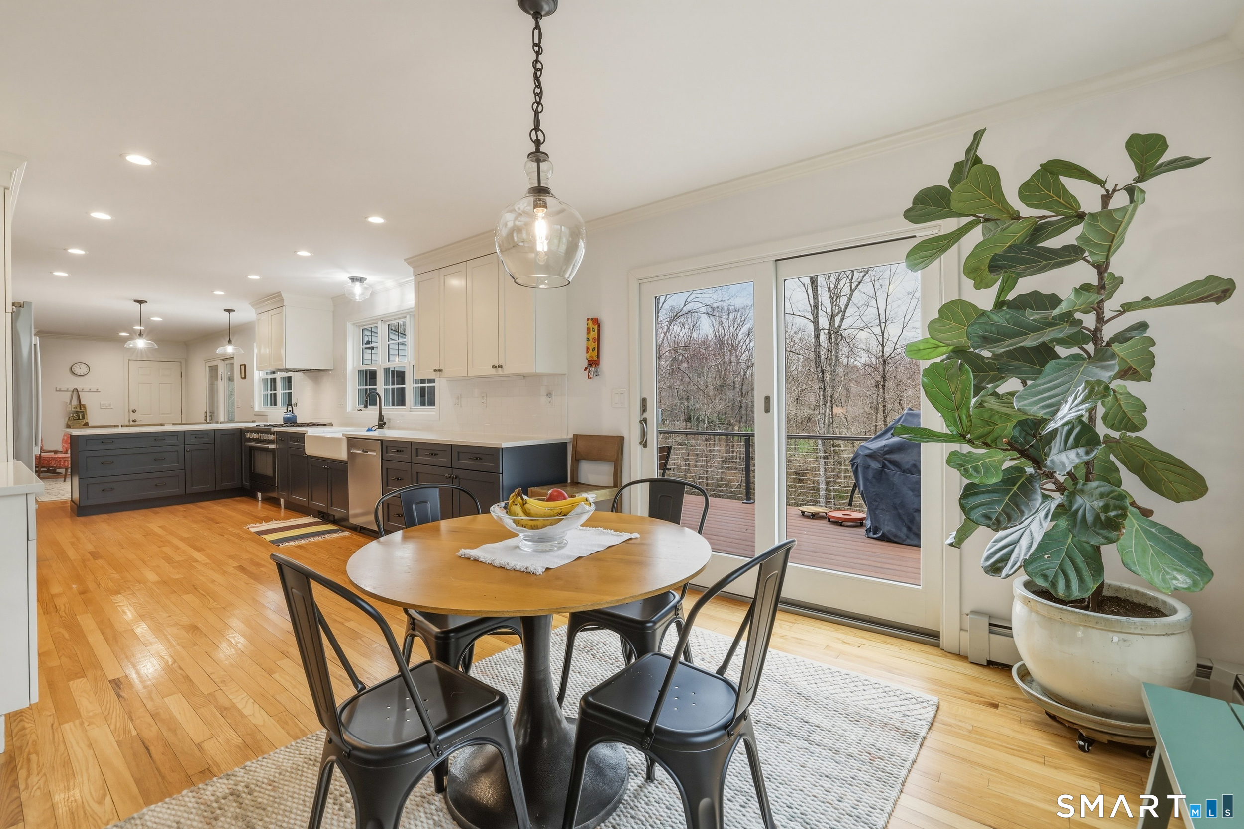 51 Sugar Loaf Road Guilford, CT 06437 - Photo 6 of 40 a dining room with furniture and potted plants