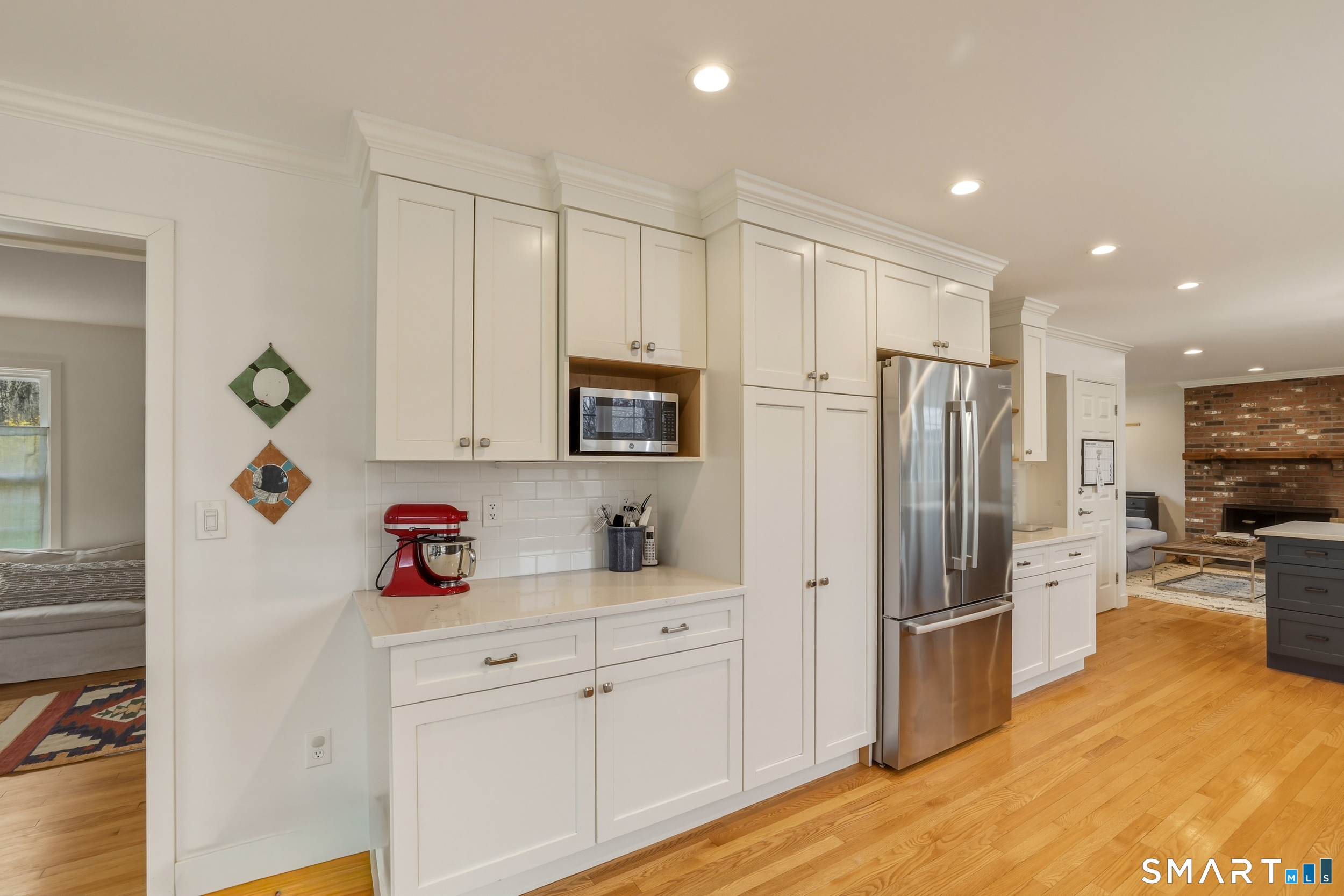 51 Sugar Loaf Road Guilford, CT 06437 - Photo 7 of 40 a kitchen with stainless steel appliances a refrigerator sink and cabinets
