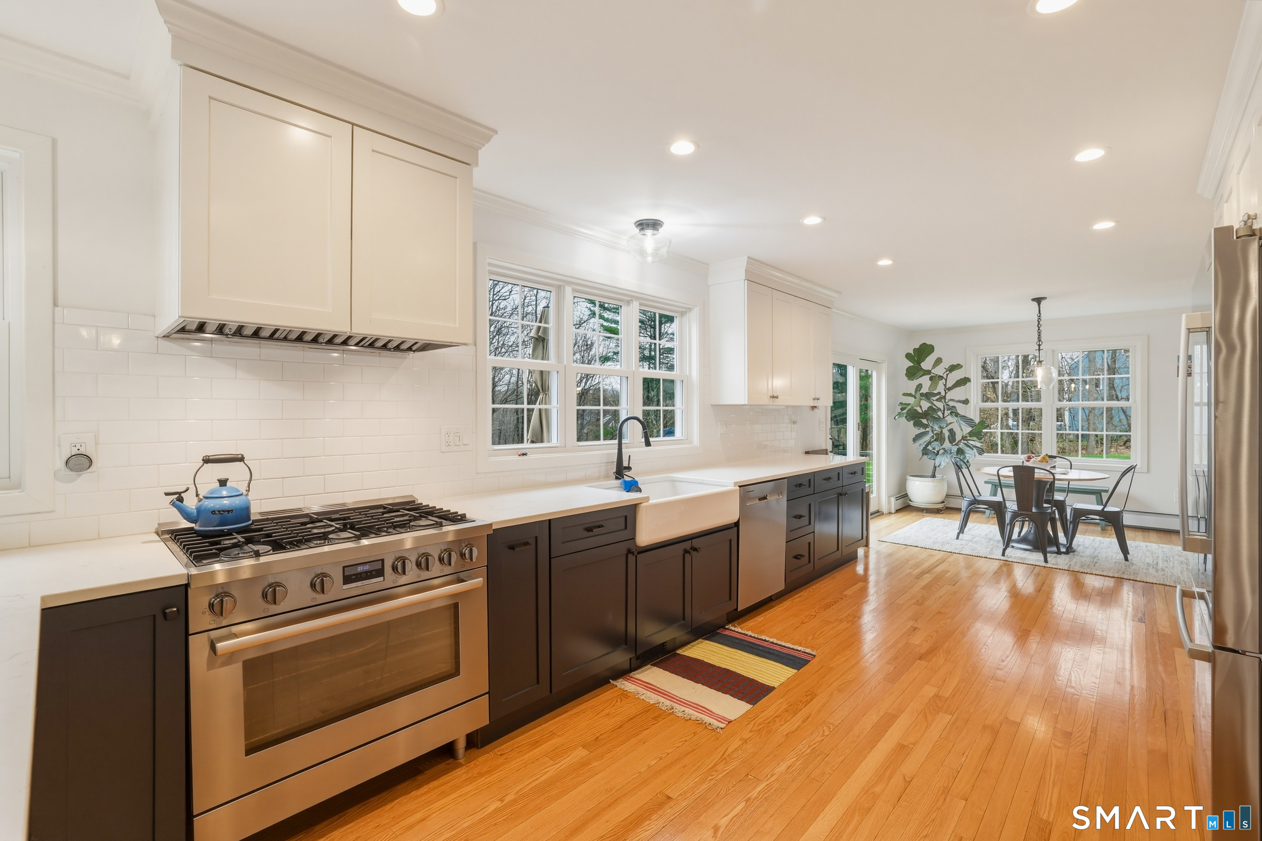51 Sugar Loaf Road Guilford, CT 06437 - Photo 8 of 40 a kitchen with stove and cabinets