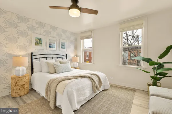 a bedroom with a large bed and a window