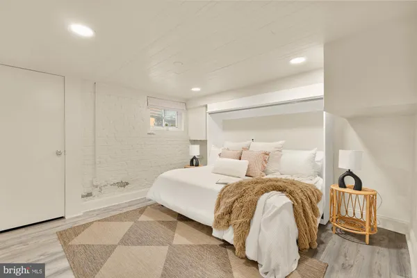 a bedroom with a bed and a table