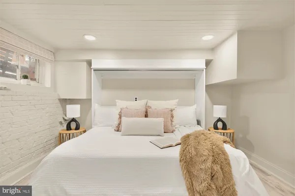 a bed room with a bed and a lamp