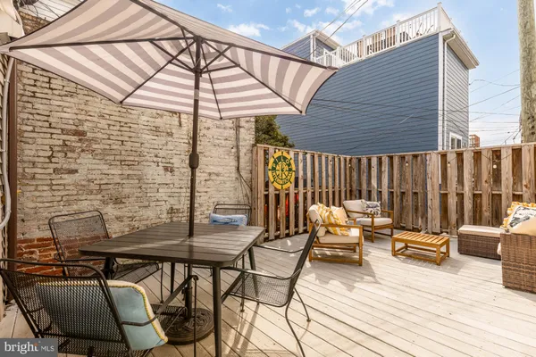 a patio with patio outdoor seating and wooden floor