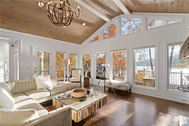 a bathroom with a sink double vanity granite tub and a mirror