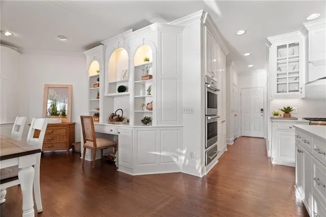 a living room with furniture and a walk in closet