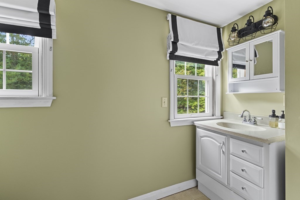 18 Pierceville Road Wareham, MA 02576 - Photo 14 of 29 a kitchen with a sink window and cabinets