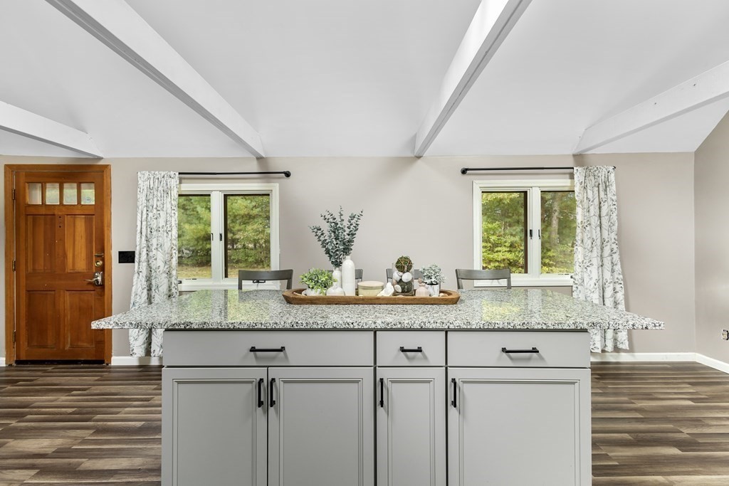 18 Pierceville Road Wareham, MA 02576 - Photo 5 of 29 a kitchen with kitchen island granite countertop a sink and a window