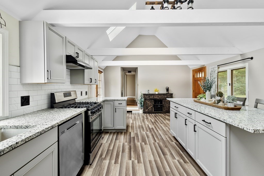 18 Pierceville Road Wareham, MA 02576 - Photo 7 of 29 a kitchen with sink stove and cabinets