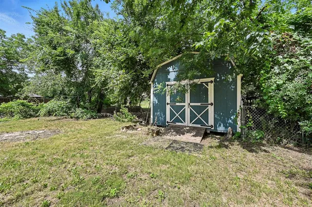 a backyard of a house with lots of green space