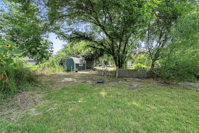 a view of outdoor space with trees all around