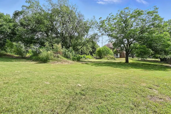 a view of a golf course with a yard