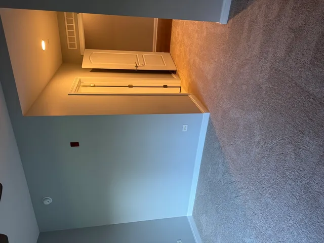 a view of entryway with kitchen